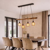 Dining room with wooden table and chairs, pendant light fixture, and large windows.